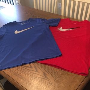 Set of two Nike “The Tee” shirts.